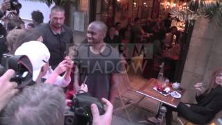 Kim Kardashian and Kanye West had dinner at Ferdi in Paris Kanye sign fake Yeezus shoes to a fan [upl. by Oikim434]