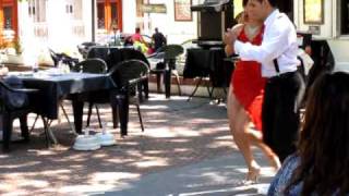 Tango dancers in Buenos Aires Plaza Dorrego San Telmo [upl. by Harahs]