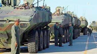 ACV amphibious combat vehicles are loaded onto a US Navy landing craft [upl. by Aihseyk]