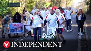 Competitors participate in annual Windlesham Boxing Day Pram Race [upl. by Idalina]