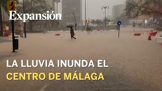 La lluvia inunda el centro de la ciudad de Málaga [upl. by Eissert]