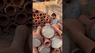 Kashmiri potter works on an earthen quottumbaknariquota goblet drum traditional to at a workshopworkout [upl. by Haimaj]