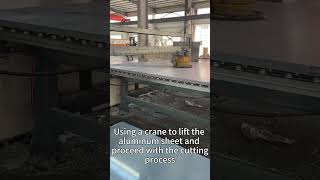 Using a crane to lift the aluminum sheet and proceed with the cutting process [upl. by Lourie]