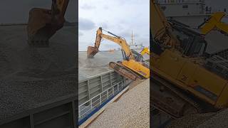 Excavator climbing onto a barge [upl. by Chemash]