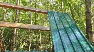 Woodland roundwood hut build part 8 The first roof panels [upl. by Tniassuot]