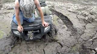 Polaris 4 wheeler stuck in the mud [upl. by Eniluqcaj652]