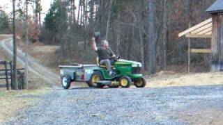 john deere lawnmower and manure spreader man goes for a ride [upl. by Nnylatsirk]