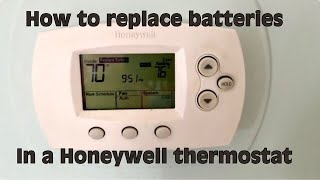 How to replace the AA batteries in a Honeywell Thermostat [upl. by Nurat]