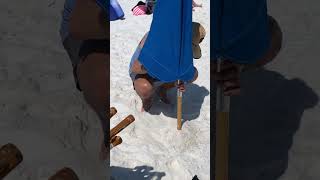 How to Setup a Beach Umbrella in Sand [upl. by Eniamaj]