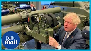 Boris Johnson inspects weapons being sent to Ukraine [upl. by Sihon104]