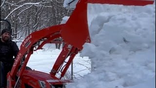 Kubota Bx 2380 Plowing snow with the bucket and rear blade  grader blade [upl. by Brick898]