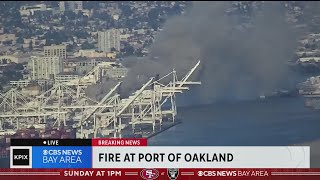 Fire burning at Port of Oakland sends huge plume of smoke into the sky [upl. by Ayotnom]