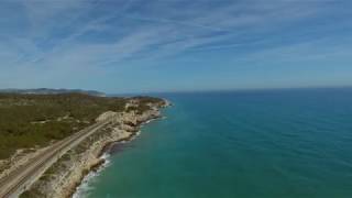 Aerial views of Vilanova i la geltru coastline cliffs and faro [upl. by Nnael]