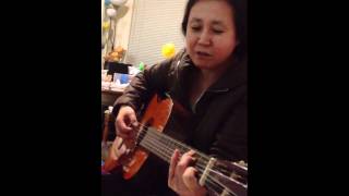 My mom playing the guitar [upl. by Aratas]