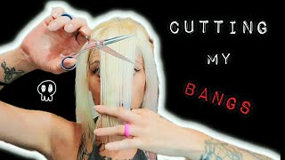 CUTTING MY BANGS TRYING A LAYERED BANG HAIRCUT TUTORIAL [upl. by Ennovaj504]