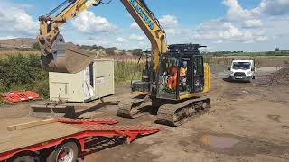 Loading excavator on to trailer [upl. by Coridon]