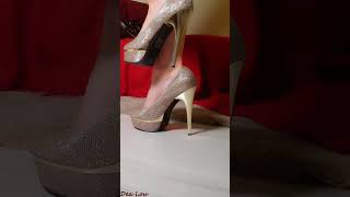 Beautiful woman wears a mini dress and golden glitter shoes in this unforgettable video [upl. by Eliam]