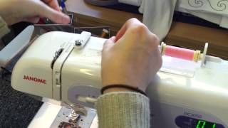 How to wind a bobbin and thread a Janome DC3050 sewing machine [upl. by Ymaral]