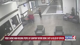 Video shows man holding people at gunpoint before being shot and killed by officer [upl. by Redman]