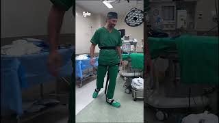 Doctor uses wearable chair in the operating room 😯 🎥 ViralHog [upl. by Eidlog]