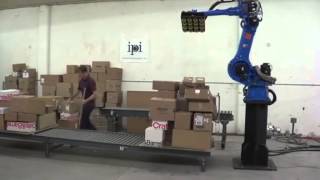 Motoman robot depalletising randomly positioned boxes [upl. by Ennailuj]