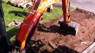 Mini Excavator Digging Out A Grass Bank [upl. by Lawson397]