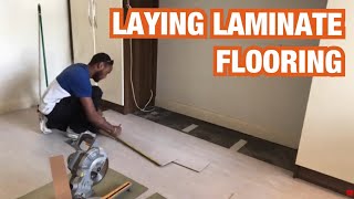 Laying laminate flooring in a bedroom [upl. by Evette]