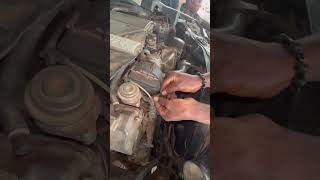 Young nigerian boy changes coil spring of a german car [upl. by Allegra]