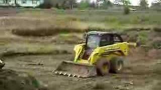 Skidsteer digging a pond [upl. by Joelie]