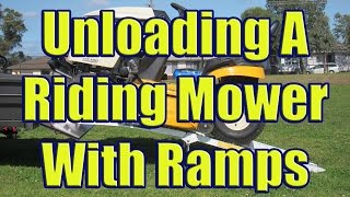 Aluminum Ramps to Load Riding Mower Using Folding Trailer Ramps for Cub Cadet LTX 1050 [upl. by Marlo]