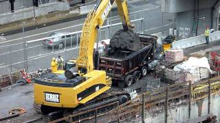 CAT 385C excavator loading a dump truck HD [upl. by Ilana571]