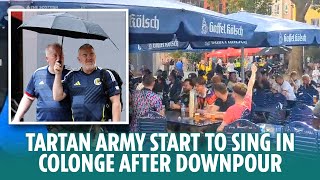 The Tartan Army start to sing in Cologne after earlier heavy rain downpour [upl. by Bradwell]