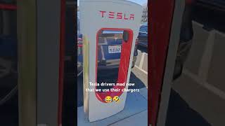 Tesla drivers dont get aggressive about it Youve been hogging our FREE chargers this whole time [upl. by Newbill]