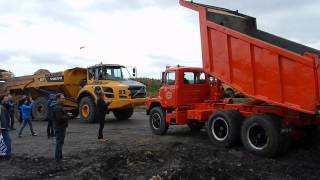 A Mack DM600 Dump Truck stuck in the mud is rescued by a Volvo A35F Truck in the Koel 2014 [upl. by Ellahcim]