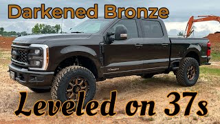 2024 Ford F250 Darkened Bronze Leveled on 37s Outdoorsman Covert [upl. by Erdnaet749]