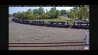 CSX steel bulkhead train with CSX pride in service unit at Deshler Railcam [upl. by Nyrol]