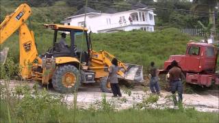 Rescuing A Mack Cement Truck That Overturned  With A JCB Backhoe [upl. by Aratas]