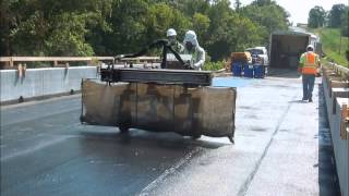 Watch Construction Equipment Videos  Waterproofing Highways with the Spraybot [upl. by Greer]