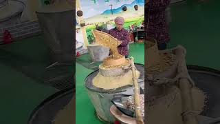 The process of grinding grains into powder with stone mills [upl. by Maryjane]