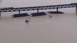 2 barges partially submerged after 10 break loose on Ohio River get stuck at bridge [upl. by Nwhas]