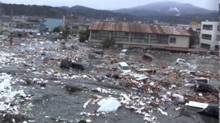 Tsunami in Kesennuma city ascending the Okawa river [upl. by Namso12]