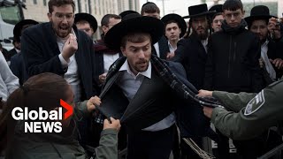 quotWe prefer to diequot Ultra Orthodox Jews scuffle with Israeli police over possible conscription [upl. by Anallise188]