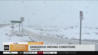 Dangerous driving conditions as snow falls in Cajon Pass [upl. by Hanfurd]