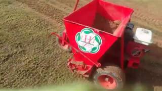 Scarifying large lawn Top dresser  soil spreader being used [upl. by Nnylireg]