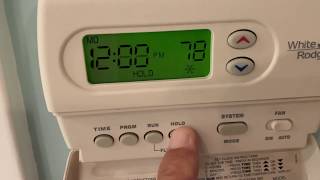 How to change the batteries in a White Rodgers thermostat [upl. by Yazbak]