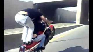 Insane Motorcyclist Is Doing a Wheelie with His Girlfriend [upl. by Corvin549]