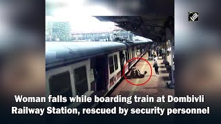 Watch Woman falls while boarding train at Dombivli Railway Station rescued by security personnel [upl. by Alek]