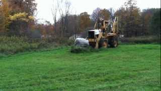 1976 International backhoe 3820A clearing 8000 lb boulder from yard [upl. by Ihtac]