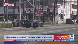 Police respond to armed man barricaded in Los Angeles 7Eleven store [upl. by Carolee287]