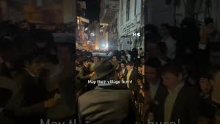 Ultraorthodox Jews sing and cheer as they burn Palestinian flags in Jerusalem neighbourhood [upl. by Nylyram]